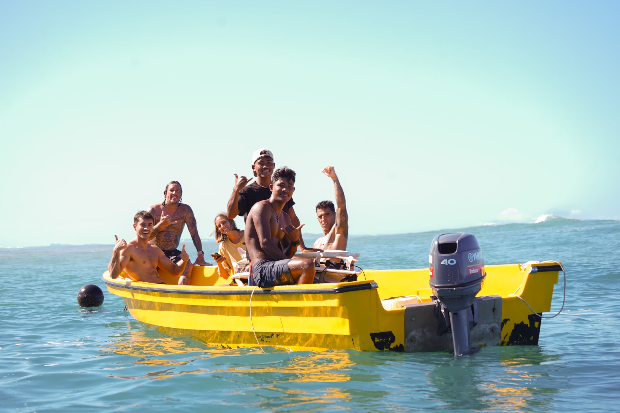 Yellow boat with passengers enjoying good vibes
